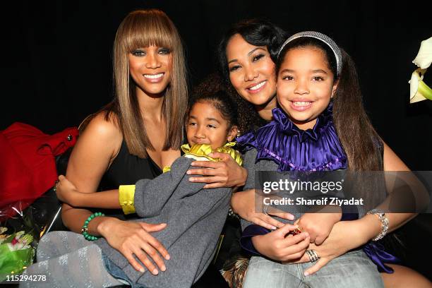 Tyra Banks, Aoki Lee Simmons, Kimora Lee Simmons and Ming Lee Simmons attend the Baby Phat by Kimora Lee Simmons fashion show during Mercedes-Benz...