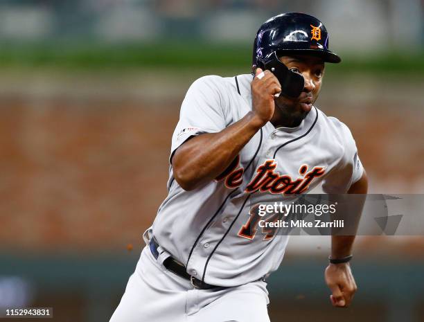 Left fielder Christin Stewart of the Detroit Tigers runs to third base after an errant throw to first base on a pickoff attempt by pitcher Jerry...