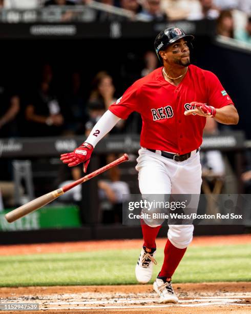 Xander Bogaerts of the Boston Red Sox hits a solo home run during the first inning of game two of the 2019 Major League Baseball London Series...