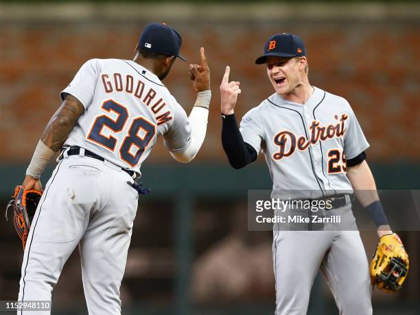 Shortstop Niko Goodrum and second baseman Gordon Beckham of the Detroit Tigers celebrate after the game against the Atlanta Braves at SunTrust Park...