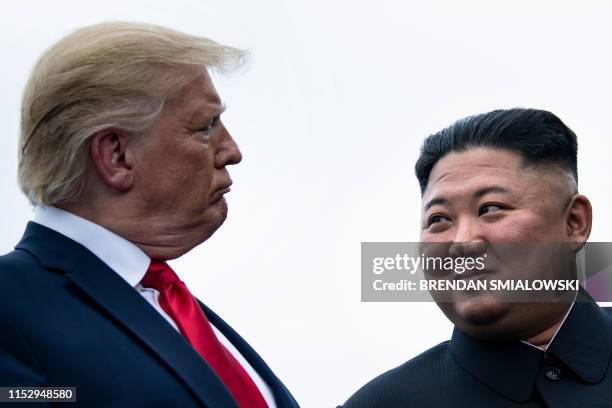 President Donald Trump and North Korea's leader Kim Jong-un talk before a meeting in the Demilitarized Zone on June 30 in Panmunjom, Korea.