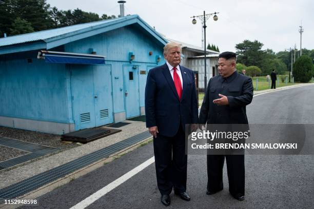 President Donald Trump and North Korea's leader Kim Jong-un talk before a meeting in the Demilitarized Zone on June 30 in Panmunjom, Korea.