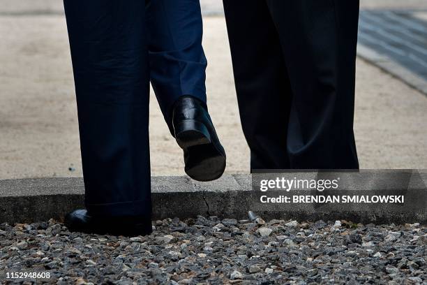 President Donald Trump steps into North Korea as North Korea's leader Kim Jong-un waits in the Demilitarized Zone on June 30 in Panmunjom, Korea.