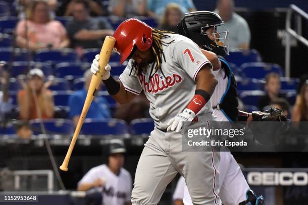 Maikel Franco of the Philadelphia Phillies hits his helmet with his bat after striking out in the second inning against the Miami Marlins at Marlins...