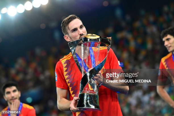 Spain's midfielder Fabian Ruiz and the tournament's best players kisses the winners' trophy after Spain won the final match of the UEFA U21 European...