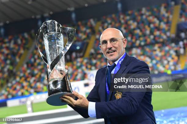 Spain's head coach Luis de la Fuente holds the winners' trophy after Spain won the final match of the UEFA U21 European Football Championships Spain...