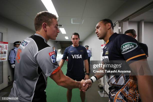 Captains Christian Lealiifano of the Brumbies and Hayden Parker of the Sunwolves shake hands prior to the Super Rugby match between Sunwolves and...
