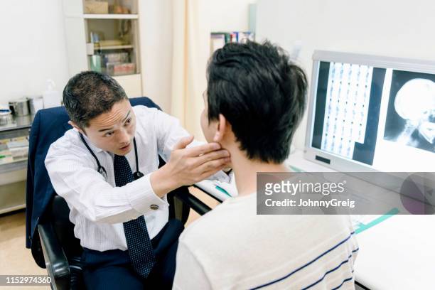 doctor examining patient - human jaw bone stock pictures, royalty-free photos & images