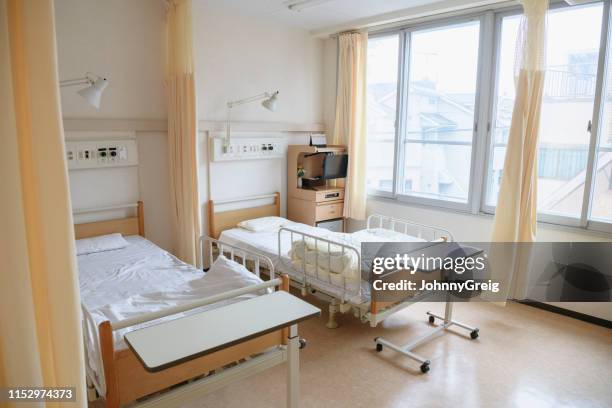two empty beds in hospital ward - hospital bed curtains stock pictures, royalty-free photos & images