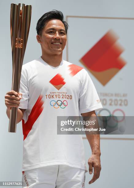 Tokyo 2020 Torch Relay Official Ambassador Tadahiro Nomura holds the Tokyo 2020 Olympic Games torch at the Tokyo 2020 Torch Relay 300 Days To Go...