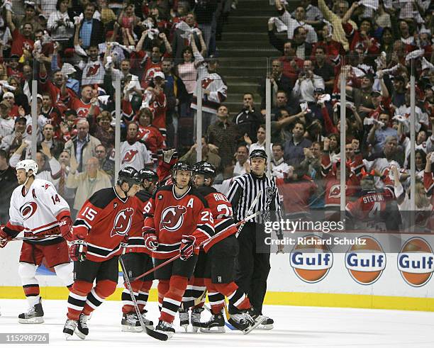 Patrik Elias of the New Jersey Devils celebrates with teammates after his goal against the Carolina Hurricanes during the second period of game three...