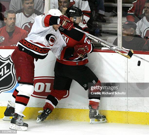 Carolina Hurricanes' Rod Brind'Amour battles Brian Rafalski of the New Jersey Devils during the third period of game three in the Eastern Conference...