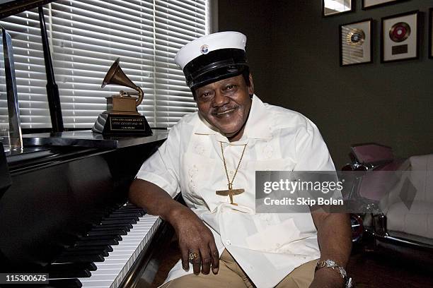 Fats Domino poses after accepting his Grammy Lifetime Achievement Award presented by the Recording Academy's Angelia Bibbs-Sanders at a ceremony to...