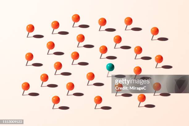 pins standing out from the crowd - map pin stock pictures, royalty-free photos & images