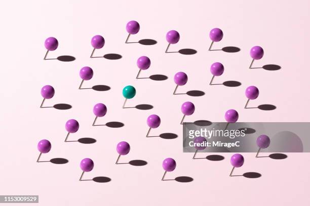 pins standing out from the crowd - single object plain background stock pictures, royalty-free photos & images