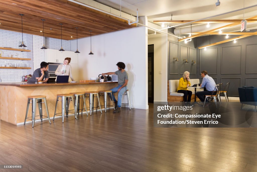 Creative business people having meetings in co-working space