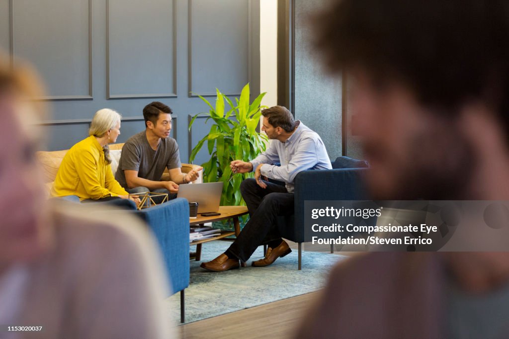 Creative business people having meeting in co-working space