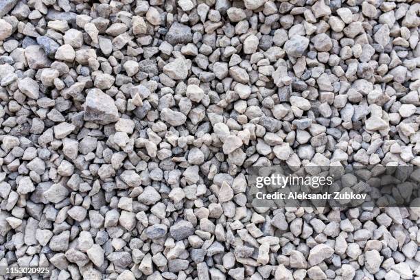 mound of granite gravel, stones, crushed stone close-up. rough seamless texture, construction material background. - sand stone wall stock pictures, royalty-free photos & images