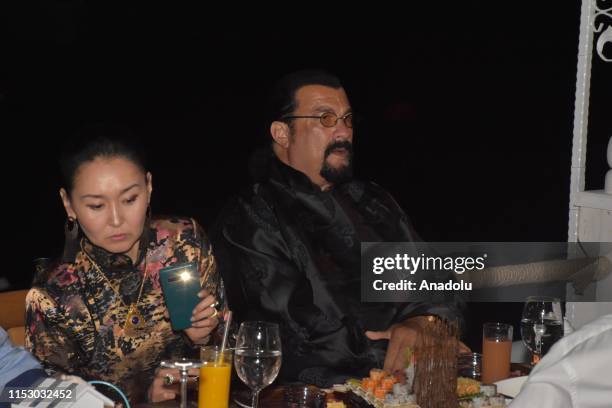 Hollywood actor Steven Seagal and his wife Erdenetuya Seagal attend a dinner following arrival on an invitation from Turkish American Business...