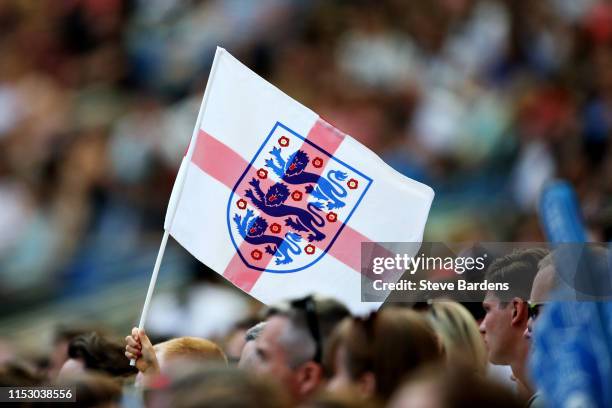 An England Women fan waves a flag during the International Friendly between England Women and New Zealand Women at Amex Stadium on June 01, 2019 in...