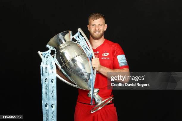 George Kruis of Saracens poses for a photograph with the trophy following the Gallagher Premiership Rugby Final between Exeter Chiefs and Saracens at...