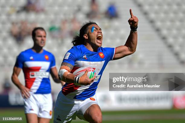 Pierre Gilles Lakafia of France reacts as he scores a try during the match between France and Scotland at the HCSB Sevens, stage of the Rugby Sevens...