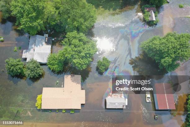 Floodwater from the Mississippi River rises up around homes on June 1, 2019 in West Alton, Illinois. The middle-section of the country has been...