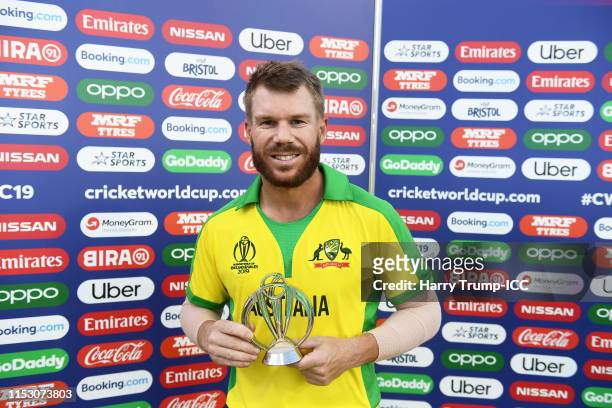 David Warner of Australia poses with the Man of the Match award during the Group Stage match of the ICC Cricket World Cup 2019 between Afghanistan...