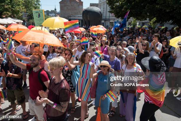 People holds placards and rainbow flags during the Pride parade. About 800 people came out at the first Pride parade held in Maribor on Saturday....