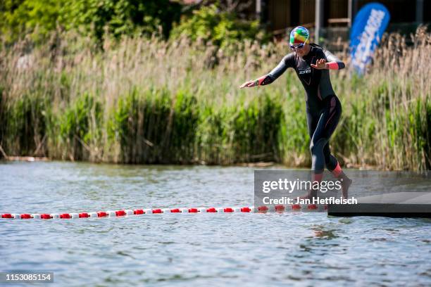 An athlete jumps into the lake Zurich ahead the IRONMAN 70.3 Rapperswil on June 01, 2019 in Rapperswil, Switzerland.