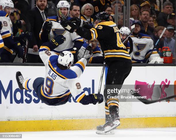 David Backes of the Boston Bruins checks Sammy Blais of the St. Louis Blues during Game Two of the 2019 NHL Stanley Cup Final at TD Garden on May 29,...