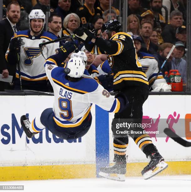 David Backes of the Boston Bruins checks Sammy Blais of the St. Louis Blues during Game Two of the 2019 NHL Stanley Cup Final at TD Garden on May 29,...