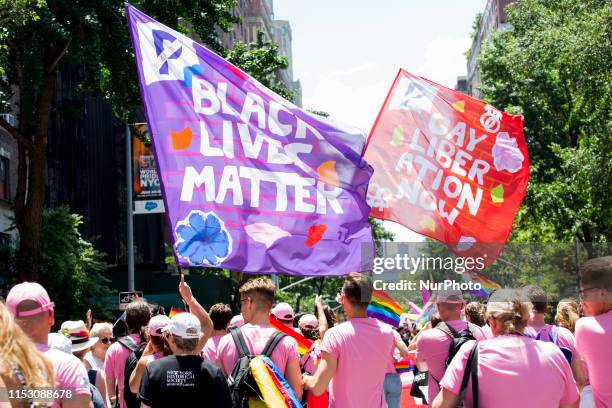 Black Lives Matter and Gay Liberation flags are waved at the annual Pride Parade on Sunday, June 29, 2019 in New York, NY. This years annual Pride...