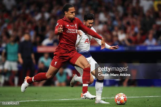 Virgin van Dijk of Liverpool tackles Heung-Min Son of Tottenham Hotspur during the UEFA Champions League Final between Tottenham Hotspur and...