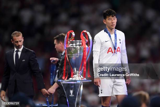 Heung-Min Son of Tottenham Hotspur walks past the trophy after the UEFA Champions League Final between Tottenham Hotspur and Liverpool at Estadio...