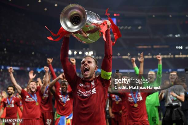 Jordan Henderson of Liverpool lifts the Champions League Trophy after winning the UEFA Champions League Final between Tottenham Hotspur and Liverpool...