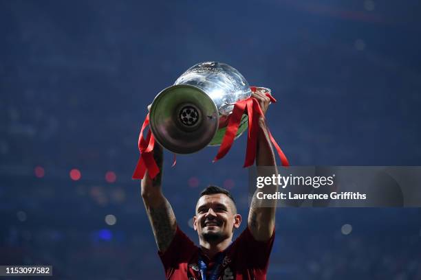Dejan Lovren of Liverpool celebrates with the Champions League Trophy after winning the UEFA Champions League Final between Tottenham Hotspur and...