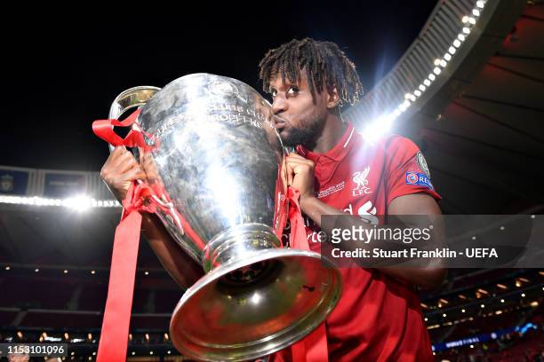 Divock Origi of Liverpool celebrates with the Champions League Trophy after winning the UEFA Champions League Final between Tottenham Hotspur and...