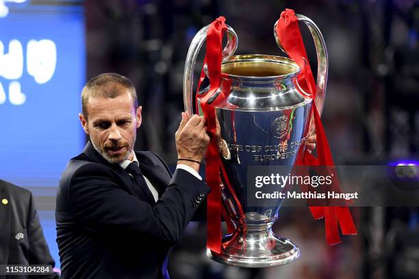 Aleksander Ceferin UEFA president picks up the Champions league trophy in preparation to presenting it to Liverpool during the UEFA Champions League...