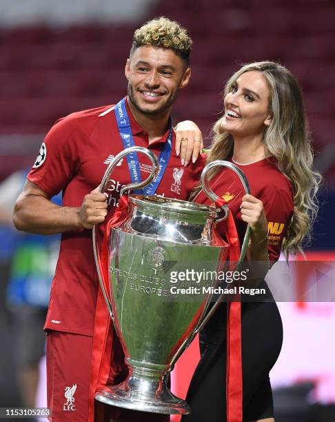 Alex Oxlade-Chamberlain of Liverpool celebrates with his girlfriend Perrie Edwards after his side won during the UEFA Champions League Final between...