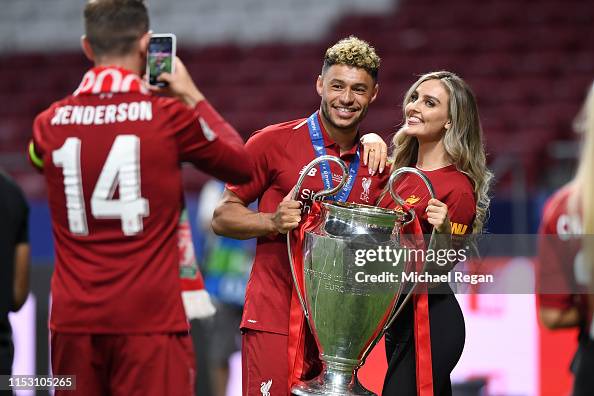Alex Oxlade-Chamberlain of Liverpool celebrates with his girlfriend