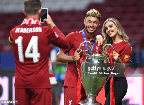 Alex Oxlade-Chamberlain of Liverpool celebrates with his girlfriend Perrie Edwards after his side won during the UEFA Champions League Final between...