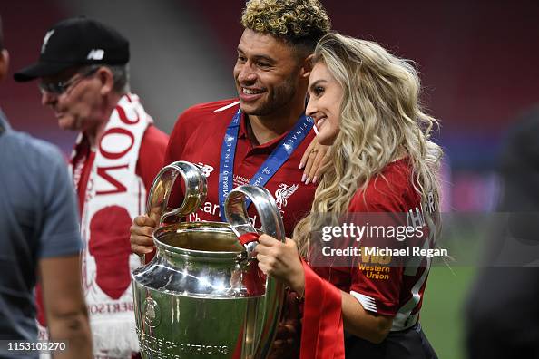 Alex Oxlade-Chamberlain of Liverpool celebrates with his girlfriend