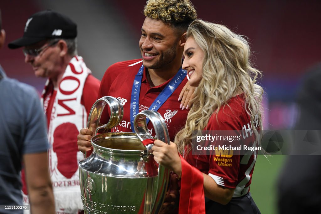 Alex Oxlade-Chamberlain of Liverpool celebrates with his girlfriend