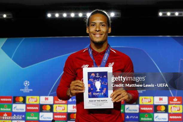 Virgil van Dijk of Liverpool poses with his Man of the Match award after the UEFA Champions League Final between Tottenham Hotspur and Liverpool at...