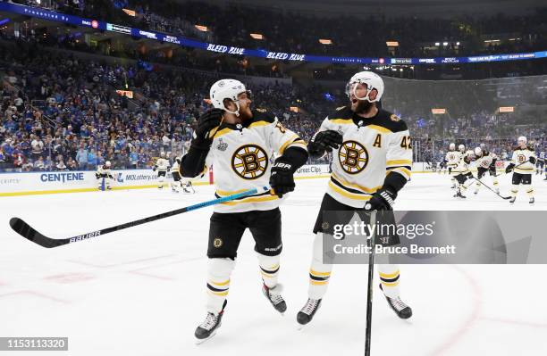 David Pastrnak and David Backes of the Boston Bruins warms up prior to Game Three of the 2019 NHL Stanley Cup Final against the St. Louis Blues at...