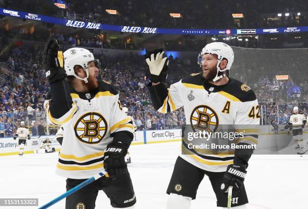 David Pastrnak and David Backes of the Boston Bruins warms up prior to Game Three of the 2019 NHL Stanley Cup Final against the St. Louis Blues at...