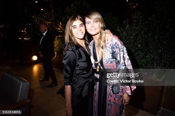 Carine Roitfeld and Heidi Klum attend the Amfar Gala At The Peninsula Hotel In Paris on June 30, 2019 in Paris, France.