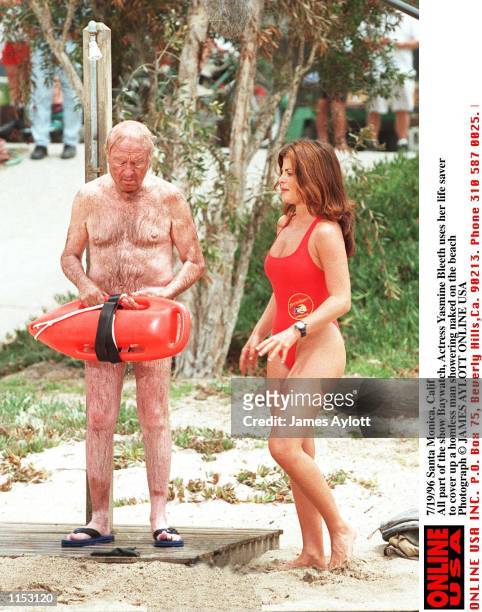 Santa Monica, Calif. 7/19/calif All Part of the Show Baywatch. In this scene actress Yasmine Bleeth uses the Famous red Life Saver to cover up a...
