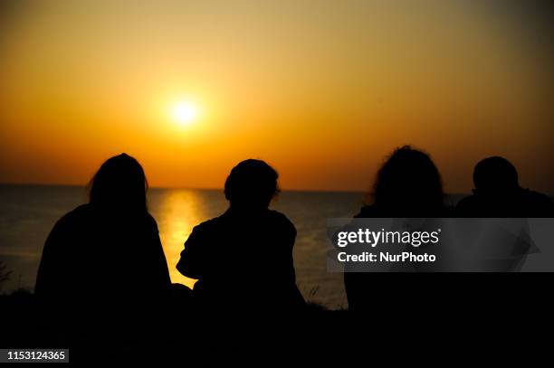 People gathered to watch the sun rising from the sea on July 1, 2019. People welcoming the first sunrise of July at the most Eastern part of...